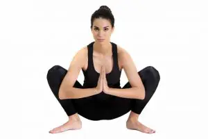 YogaFX Woman doing Garland Pose YogaFX Yoga Teacher Training Course Canggu Bali