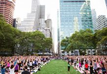 YogaFX Large group of people doing yoga at Central Park NY