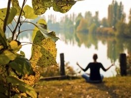 YogaFX Woman doing meditation in Autumn season