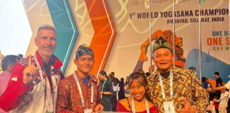 World Yogasana Championship 2026 in Ahmedabad: Indonesian medallists Ivara Candra Kartika and Arkan Fauzan Riyanto holding their seven medals