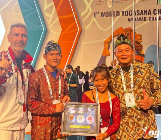 World Yogasana Championship 2026 in Ahmedabad: Indonesian medallists Ivara Candra Kartika and Arkan Fauzan Riyanto holding their seven medals