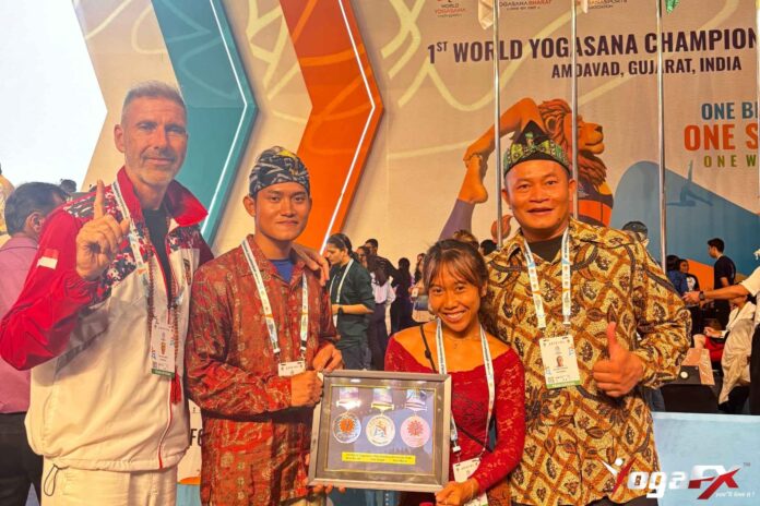 World Yogasana Championship 2026 in Ahmedabad: Indonesian medallists Ivara Candra Kartika and Arkan Fauzan Riyanto holding their seven medals World Yogasana Championship 2026 in Ahmedabad: Indonesian medallists Ivara Candra Kartika and Arkan Fauzan Riyanto holding their seven medals