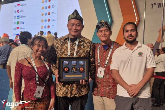 YogaFX graduates Arkan Fauzan Riyanto and Ivara Candra Kartika at World Yogasana Sport Championship Ahmedabad 2026
