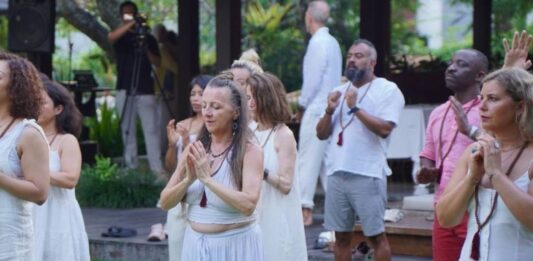 YogaFX Graduate Stories: From 1,500+ Alumni in 80+ Countries YogaFX graduates celebrating on Graduation Day at the Seminyak, Bali studio, part of a cohort representing the academy's 1,500+ alumni across 80+ countries.