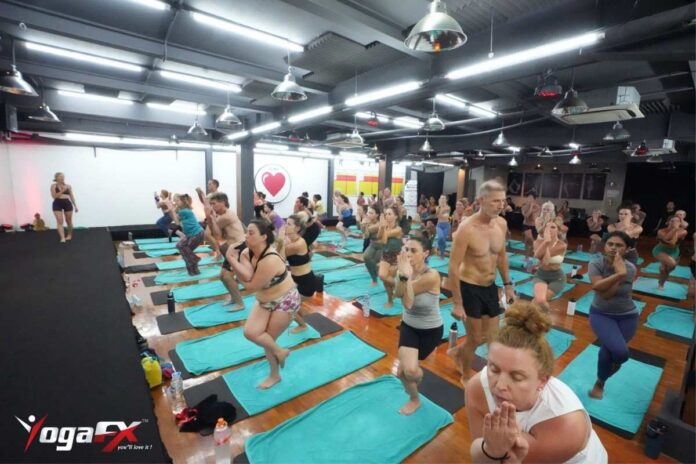 Instructor course candidates practicing standing series posture clinic and alignment cues during YogaFX Bikram yoga instructor training in Seminyak, Bali. Instructor course candidates practicing standing series posture clinic and alignment cues during YogaFX Bikram yoga instructor training in Seminyak, Bali.