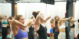 US student practicing Bikram Hot 26&2 posture during YogaFX teacher training intensive in Seminyak, Bali