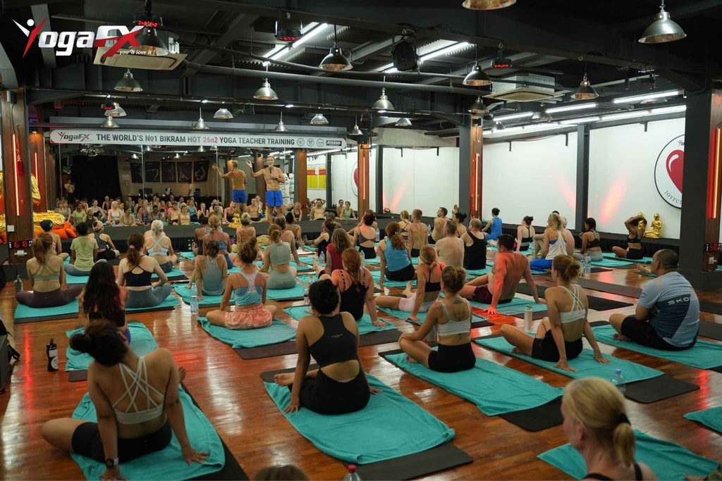 Mr. Ian Terry teaching a capped cohort including Singapore-based students at YogaFX Bali