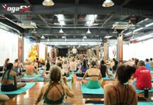 How Many Hours Do You Need to Become a Yoga Instructor? Yoga instructor trainee counting required training hours toward a Yoga Alliance RYT 200 certification during a hybrid teacher training program