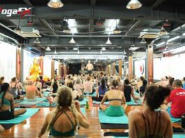 How Many Hours Do You Need to Become a Yoga Instructor? Yoga instructor trainee counting required training hours toward a Yoga Alliance RYT 200 certification during a hybrid teacher training program