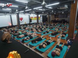 Indian student practicing Bikram Hot 26&2 posture in natural tropical heat at YogaFX Bali studio