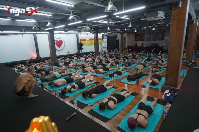 Indian student practicing Bikram Hot 26&2 posture in natural tropical heat at YogaFX Bali studio Indian student practicing Bikram Hot 26&2 posture in natural tropical heat at YogaFX Bali studio